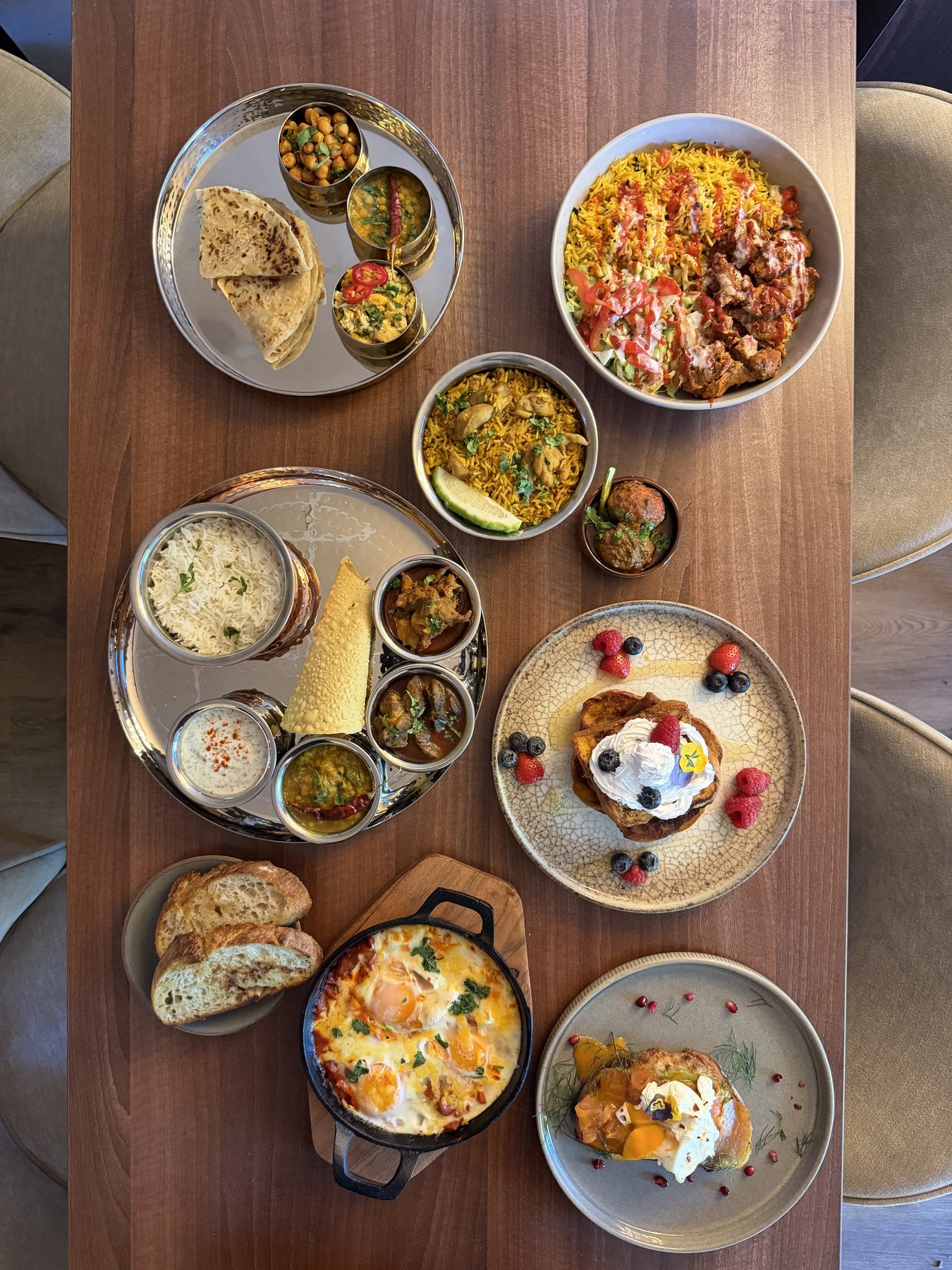 A spread of dishes at Chaya Cafe, from French toast to biryani thalis