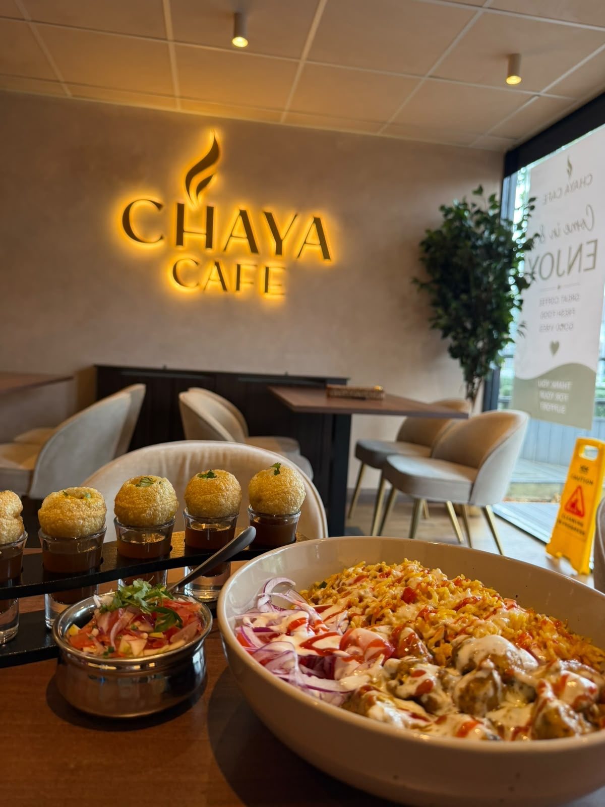 Pani puri and a rice bowl on the table at Chaya Cafe